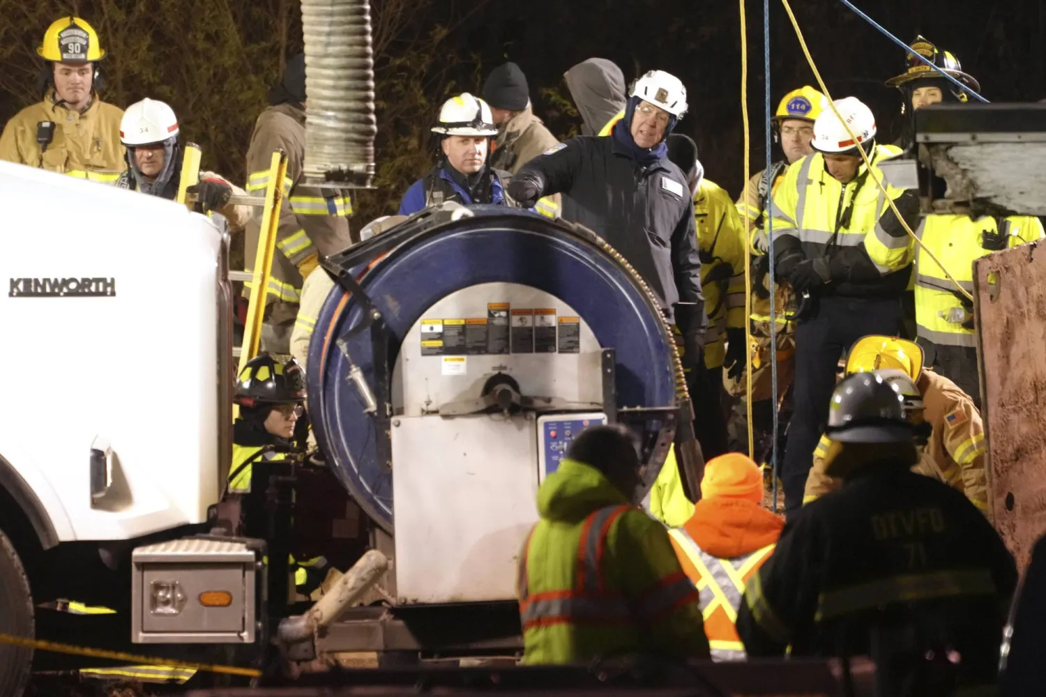 Rescue workers search in a sinkhole for Elizabeth Pollard, who disappeared while looking for her cat, in Marguerite, Pa., Tuesday, Dec. 3, 2024. (AP Photo/Gene J. Puskar)