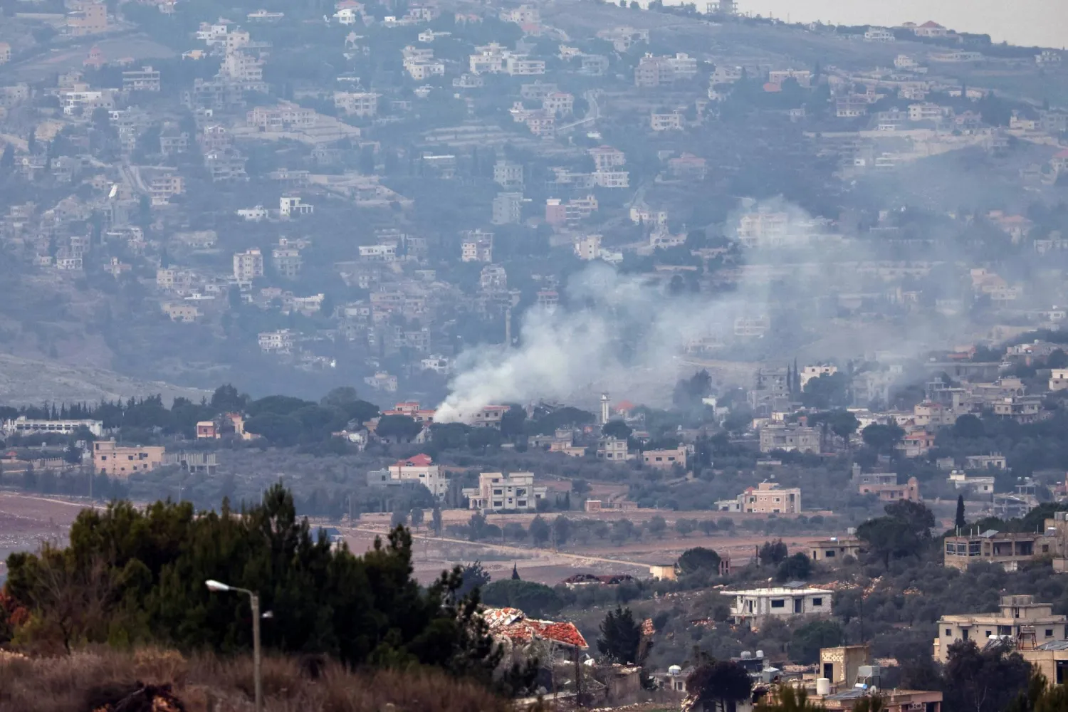Smoke rises as a result of an Israeli strike next to the south Lebanon village of Hula  as seen from the Israeli side of the border, 04 December 2024. EPA/ATEF SAFADI
