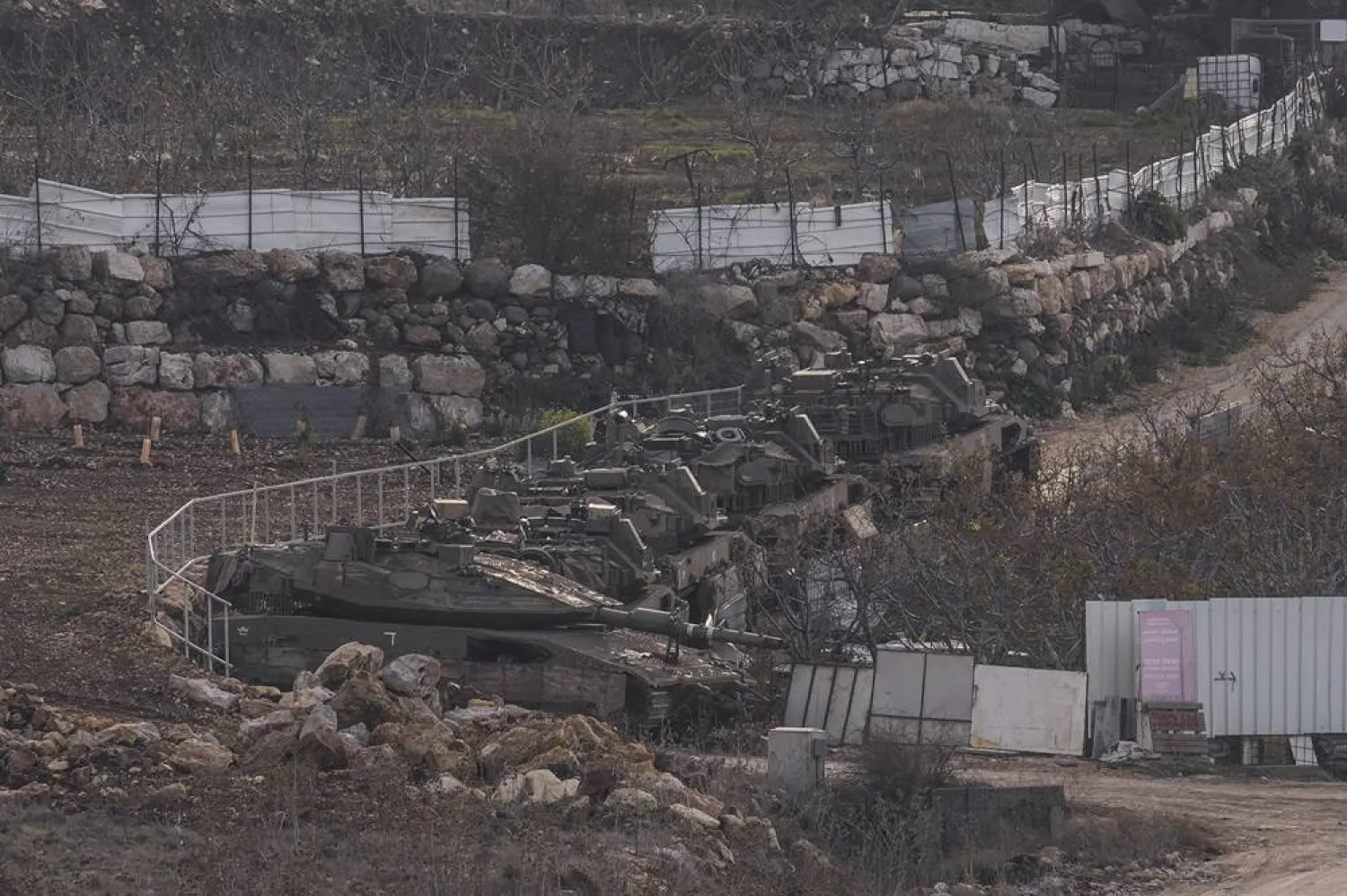  Israeli armored vehicles park near the so-called Alpha Line that separates the Israeli-occupied Golan Heights from Syria, Sunday, Dec. 8, 2024. (AP)
