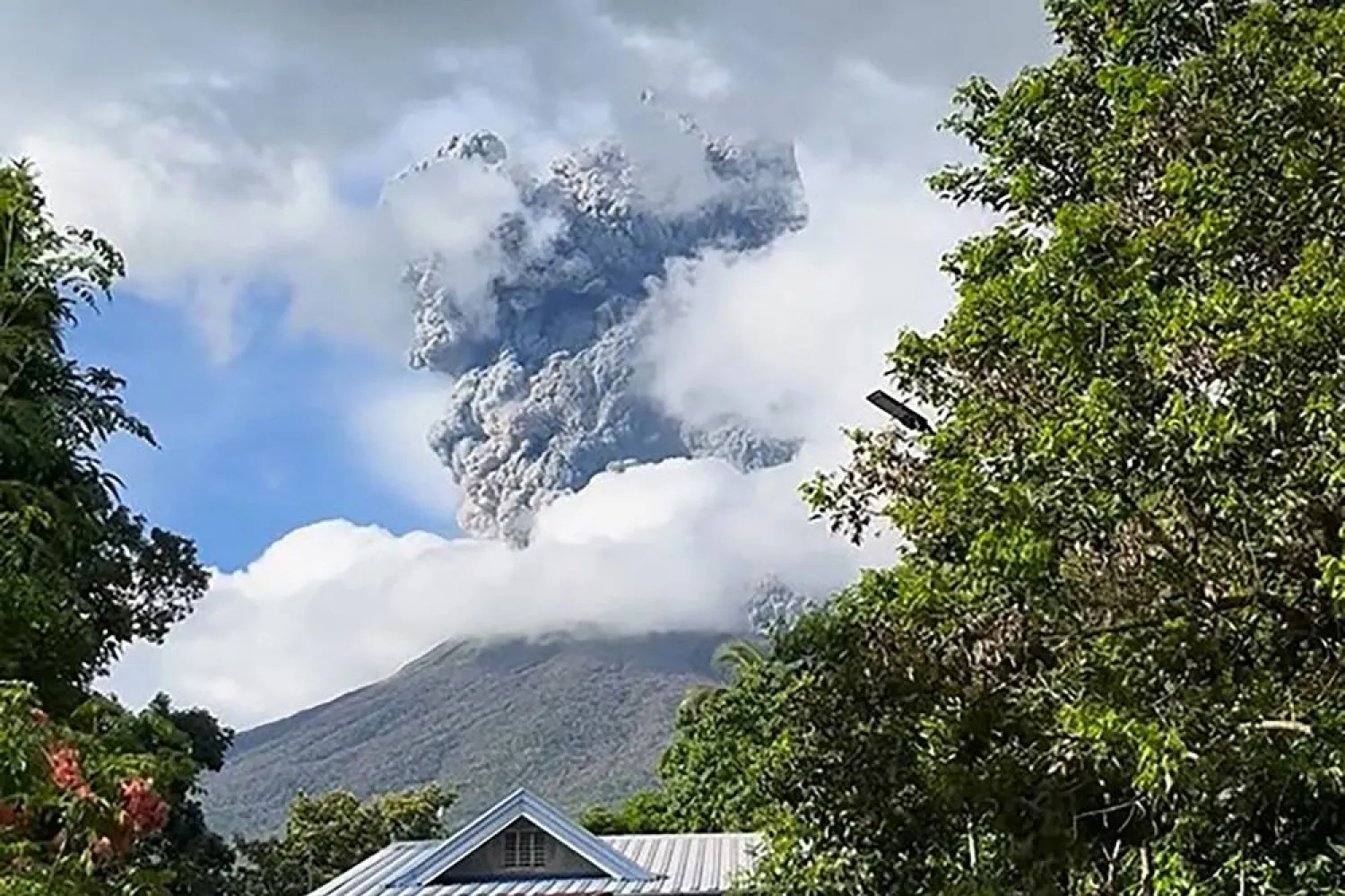 This frame grab from video footage taken on December 9, 2024 and posted on the Facebook account of Dianne Paula Abendan shows the eruption of Kanlaon volcano as seen from Biak na Bato village in La Castellana town in Negros Occidental province, central Philippines. (AFP Photo / Courtesy of Dianne Paula Abendan via Facebook) 