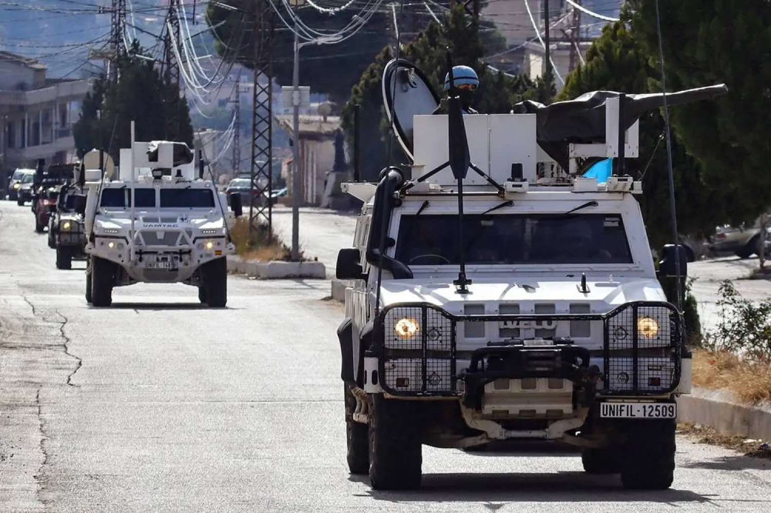  Armored vehicles of the United Nations Interim Force in Lebanon (UNIFIL) patrol the streets of the southern area of Marjeyoun near the border with Israel on December 6, 2024. (AFP) 