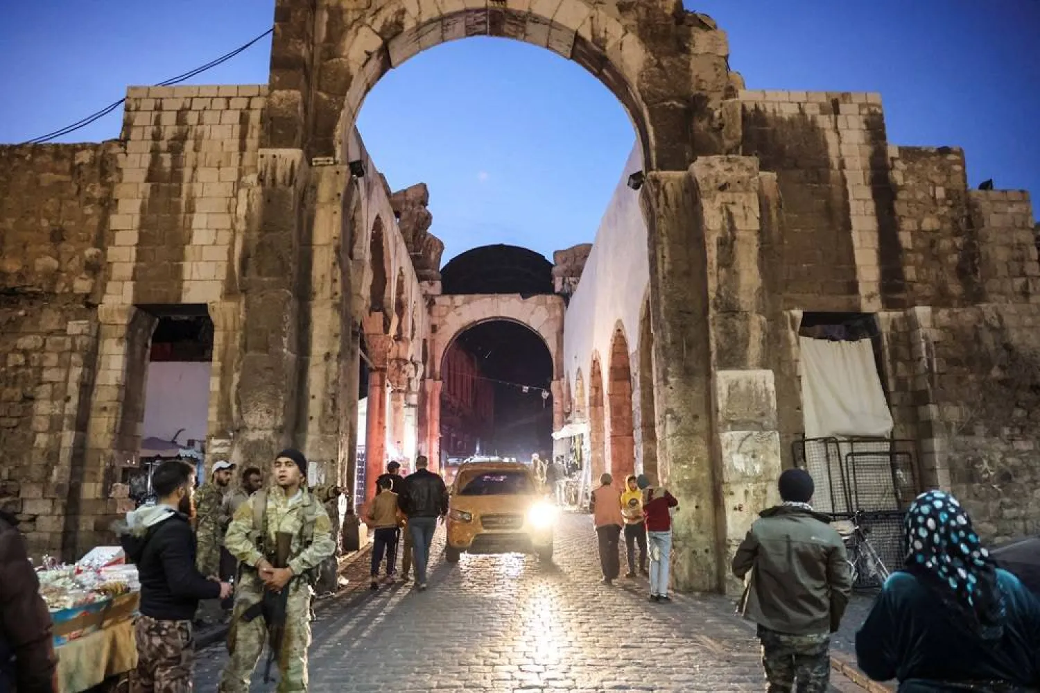  People walk, after opposition fighters seized the capital and ousted Syria's Bashar al-Assad, in Damascus, Syria December 9, 2024. (Reuters)