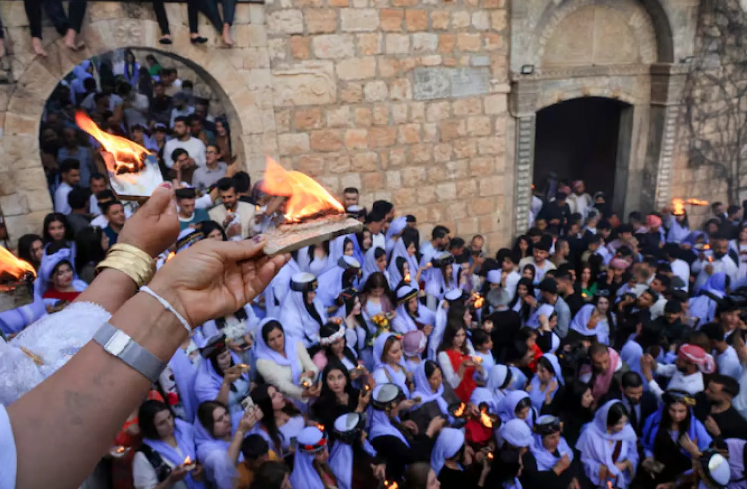 Iraqi Yazidi women light candles on the occasion of Red Wednesday, a ceremony to celebrate the Yazidi New Year at Lalish temple in Shekhan District in Duhok province, Iraq April 16, 2024. REUTERS/Ari Jalal/File Photo 