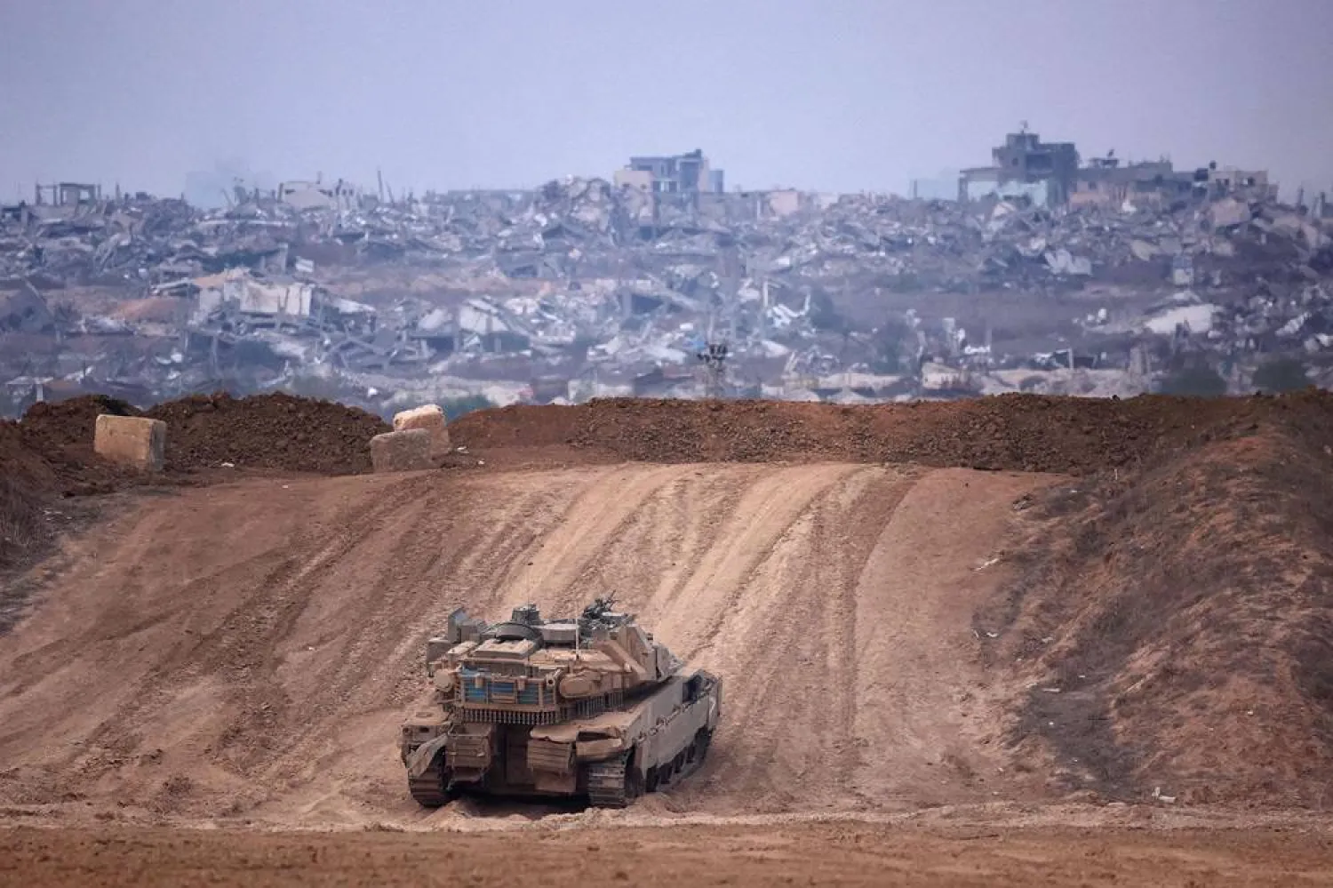 An Israeli army tank drives into position near Israel's southern border with the Gaza Strip on December 11, 2024, amid the ongoing war between Israel and the Hamas group. (AFP)