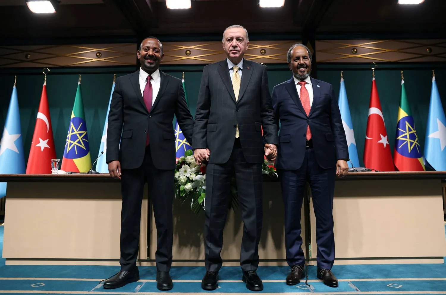 Turkish President Tayyip Erdogan poses with Somali President Hassan Sheikh Mohamud and Ethiopian Prime Minister Abiy Ahmed following a press conference in Ankara, Türkiye, December 11, 2024. Murat Kula/Presidential Press Office/Handout via REUTERS  