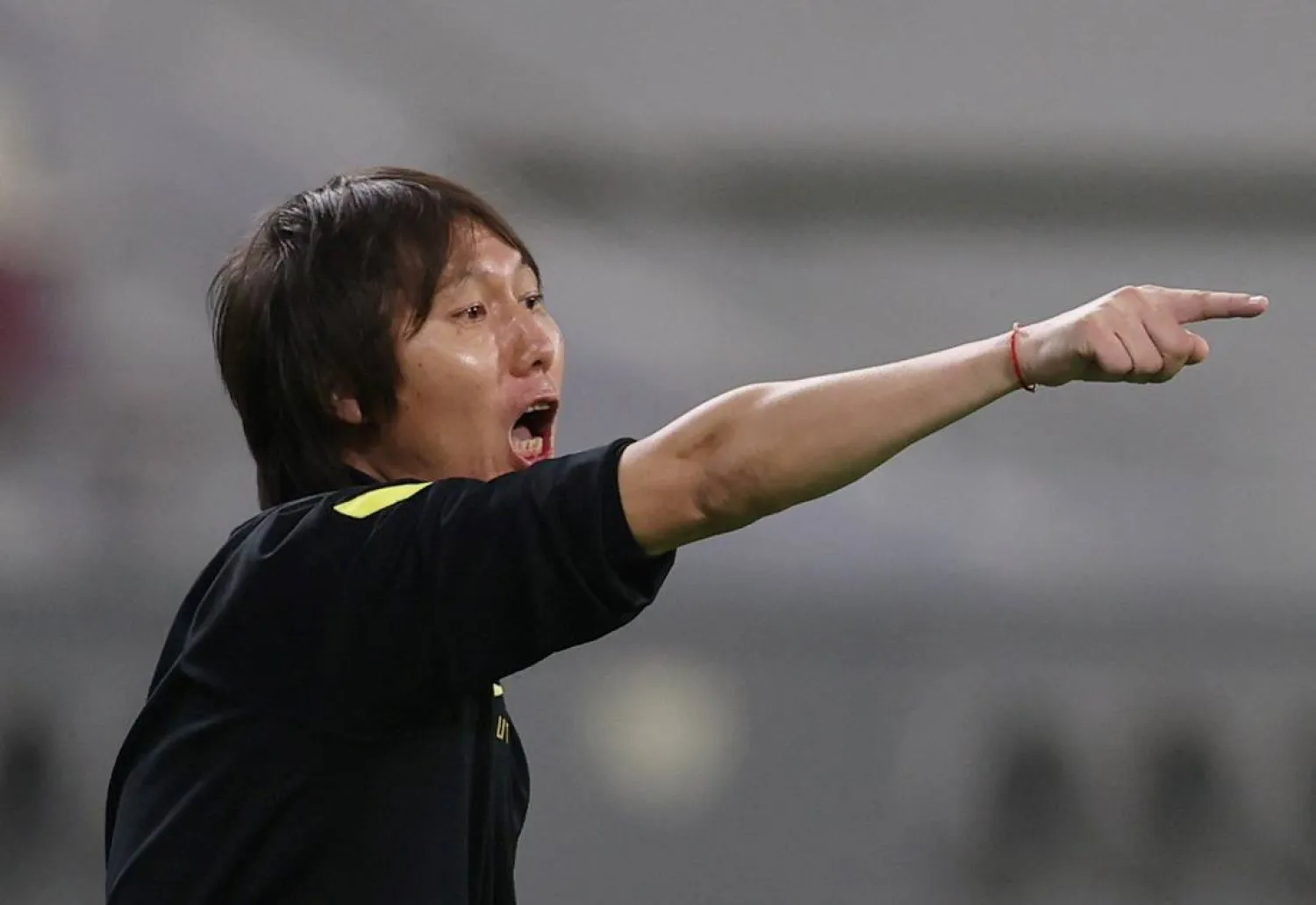 FILE PHOTO: Soccer Football - World Cup - Asia Qualifiers - Group B - Australia v China - Khalifa Stadium, Doha, Qatar - September 2, 2021 China coach Li Tie reacts REUTERS/Ibraheem Al Omari/File Photo