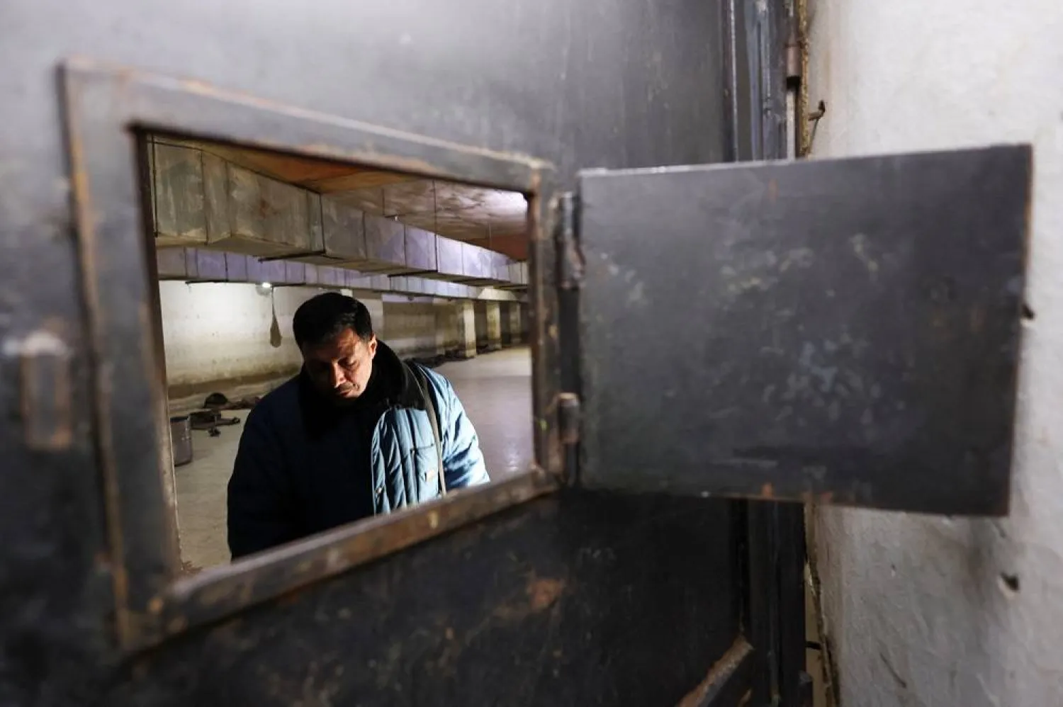 Bassem Faiz Mawat, 48, a former Syrian prisoner from Damascus reacts after an interview with Reuters TV inside his cell room at underground famous prison "Branch 215" which was operated by Syrian Military Intelligence, after the opposition seized the capital and ousted Syria's Bashar al-Assad, in Damascus, Syria December 11, 2024. (Reuters) 