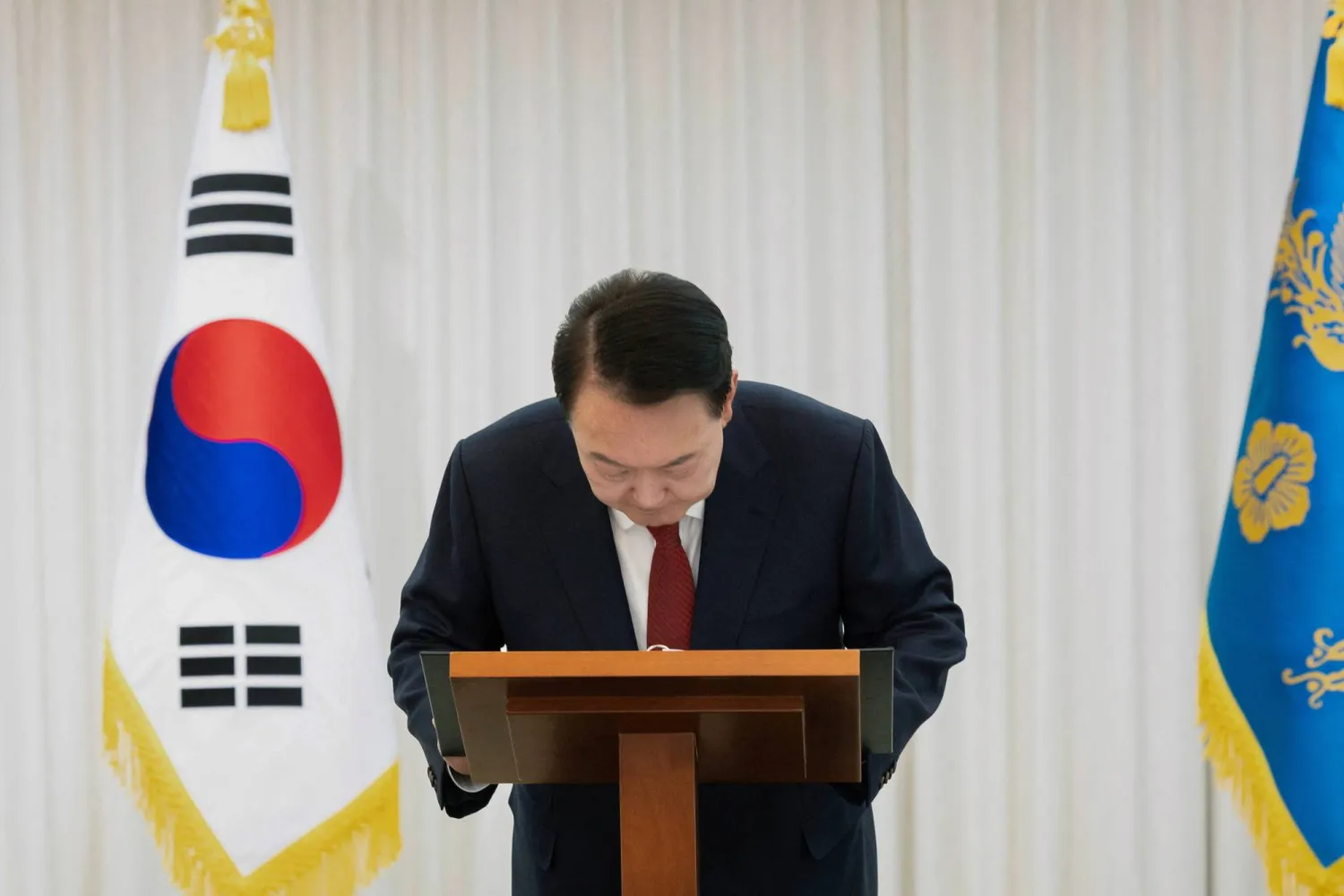 South Korean President Yoon Suk Yeol delivers an address to the nation at his official residence in Seoul, South Korea, December 14, 2024. The Presidential Office/Handout via REUTERS 