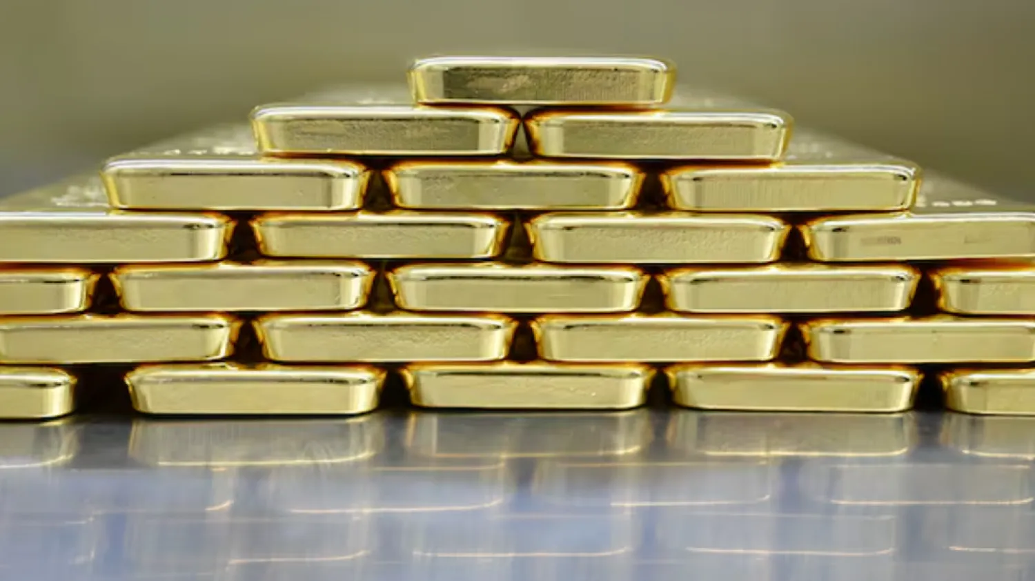 Gold bars are stacked in the safe deposit boxes room of the Pro Aurum gold house in Munich, Germany, January 10, 2025. REUTERS/Angelika Warmuth/File Photo 
