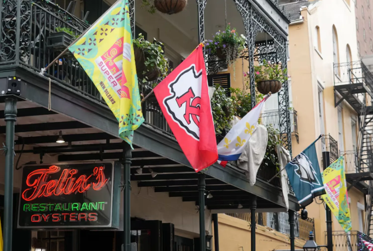 Feb 4, 2025; New Orleans, LA, USA; Super Bowl LIX, Kansas City Chiefs and Philadelphia Eagles flags at Felix's Oyster restaurant on Bourbon Street. Mandatory Credit: Kirby Lee-Imagn Images /Reuters