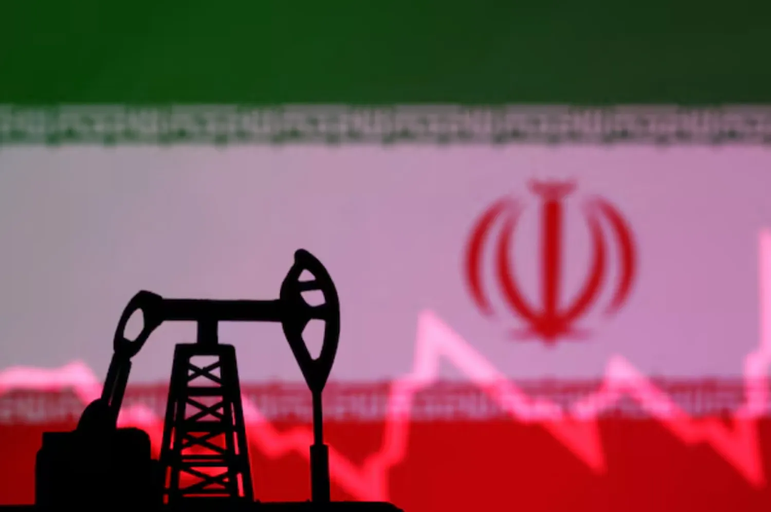 Iranian flag with stock graph and an oil pump jack miniature model are seen in this illustration taken October 9, 2023. REUTERS/Dado Ruvic/Illustration/File Photo