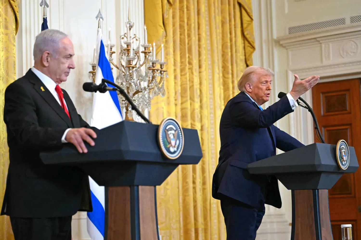 US President Donald Trump (R) and Israel's Prime Minister Benjamin Netanyahu hold a press conference in the East Room of the White House in Washington, DC, on February 4, 2025. (Photo by ANDREW CABALLERO-REYNOLDS / AFP)