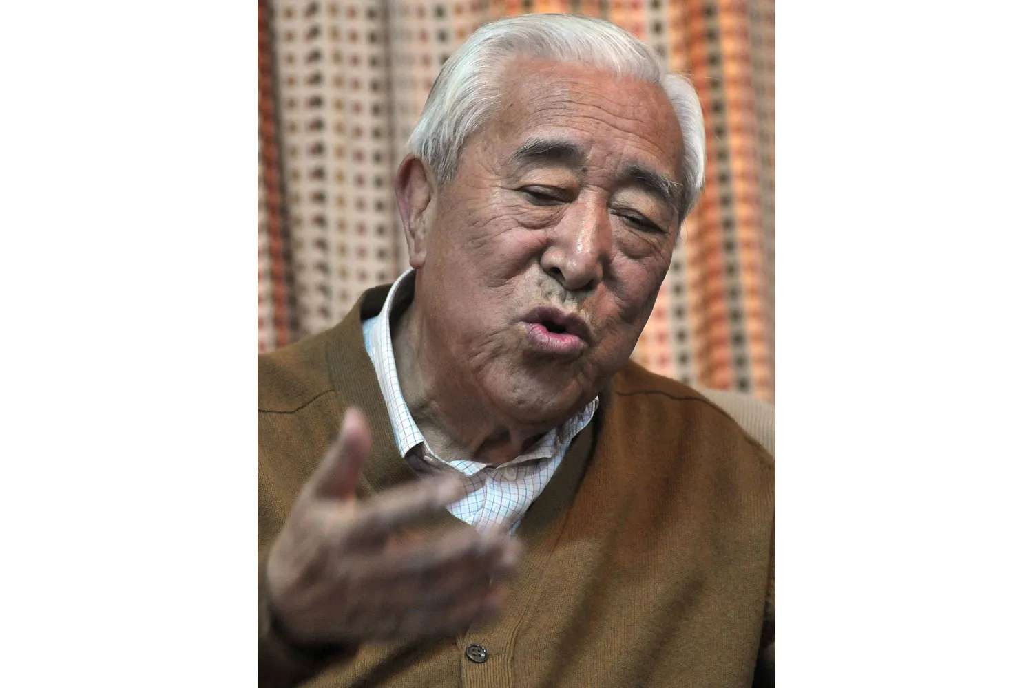 FILE - Gyalo Thondup, elder brother of the Dalai Lama, speaks to media in Dharamshala, India, Nov. 19, 2008. (AP Photo/Ashwini Bhatia, File)