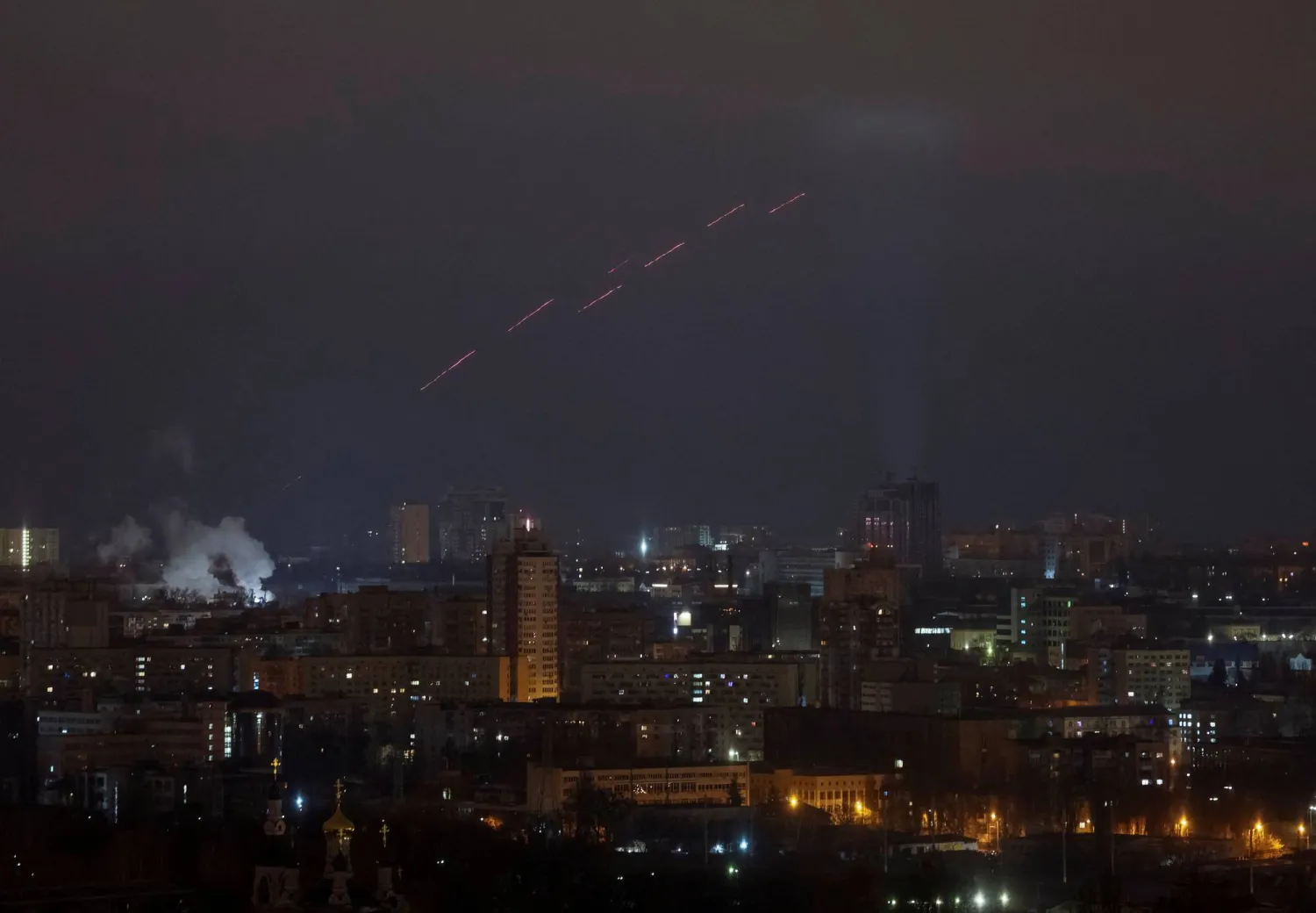 Tracers are seen in the night sky as Ukrainian servicemen fire at the drone during a Russian drone strike, amid Russia's attack on Ukraine, in Kyiv, Ukraine February 8, 2025. REUTERS/Gleb Garanich