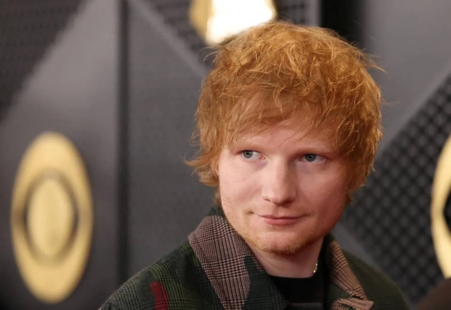 Ed Sheeran poses on the red carpet as he attends the 66th Annual Grammy Awards in Los Angeles, California, US, February 4, 2024. (Reuters) 