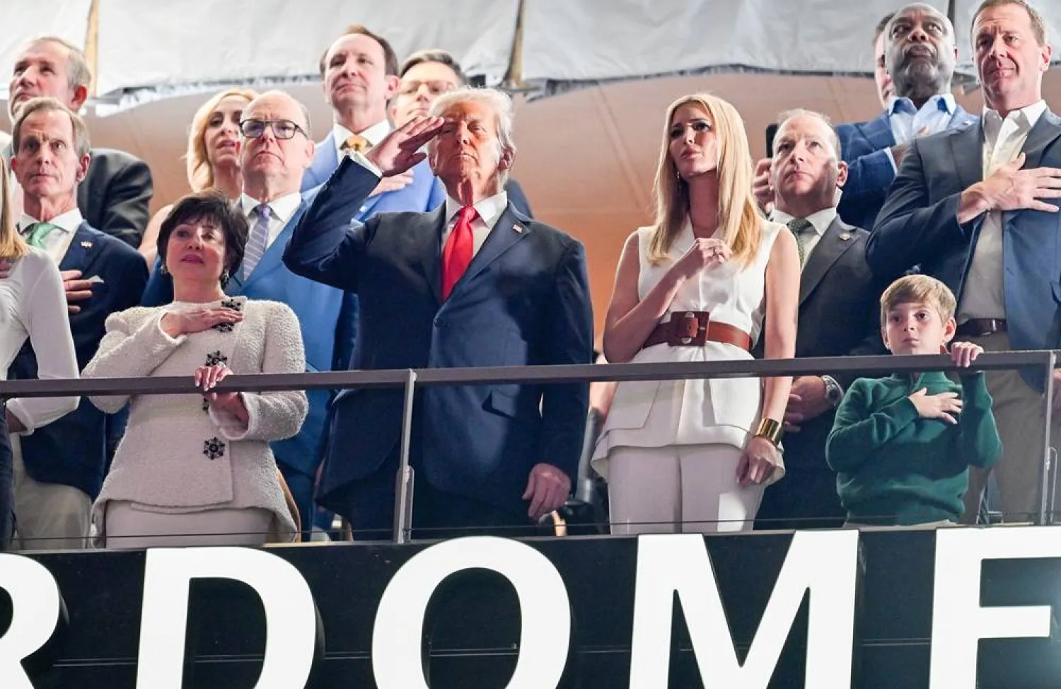 09 February 2025, US, New Orleans: US President Donald Trump salutes as the national anthem is played ahead of the Super Bowl LIX American football match between the Kansas City Chiefs and the Philadelphia Eagles at Caesars Superdome. (dpa) 