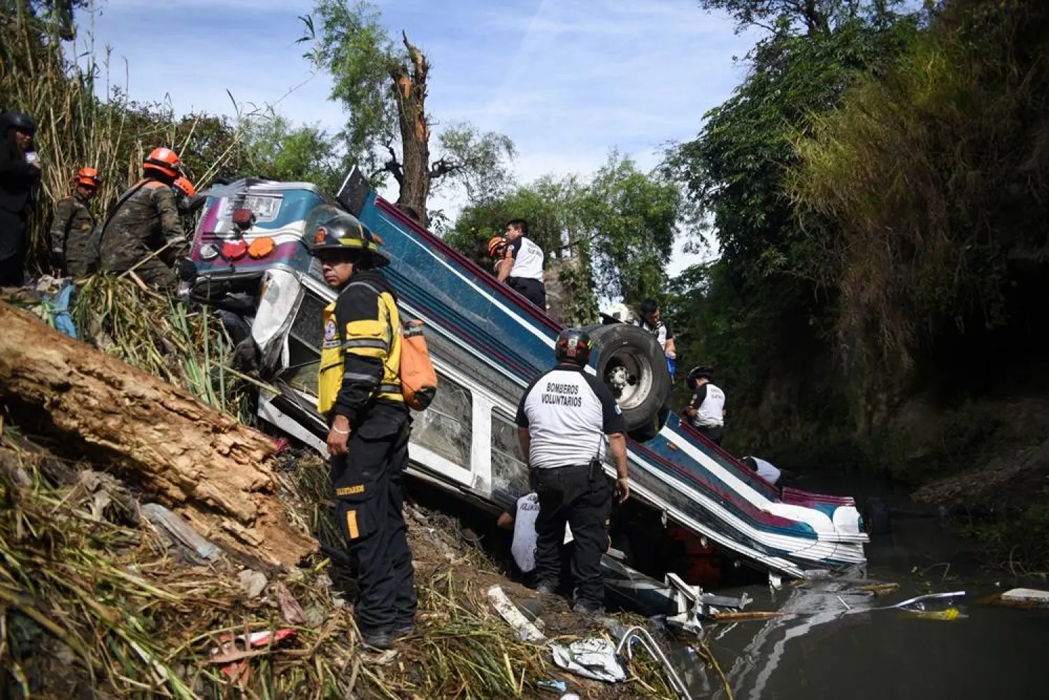 First responders work at the site of a deadly bus crash, in Guatemala City, Guatemala, February 10, 2025. (Reuters) 