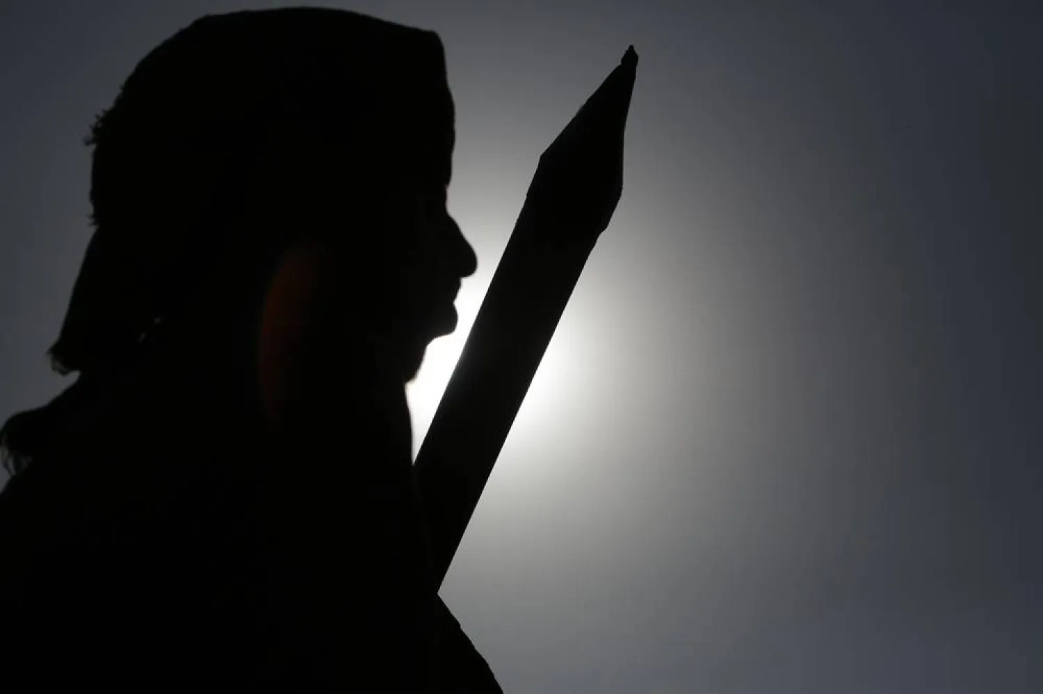  27 December 2024, Yemen, Sanaa: A Yemen's Houthi supporter brandishes a rifle during a demonstration against the United States and Israel in Sanaa. (dpa)