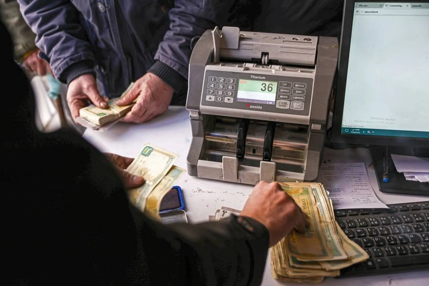 A retired Syrian employee waits to receive their salary for the first time after the fall of Bashar al-Assad's regime, in Damascus, Syria, 06 February 2025. (EPA)