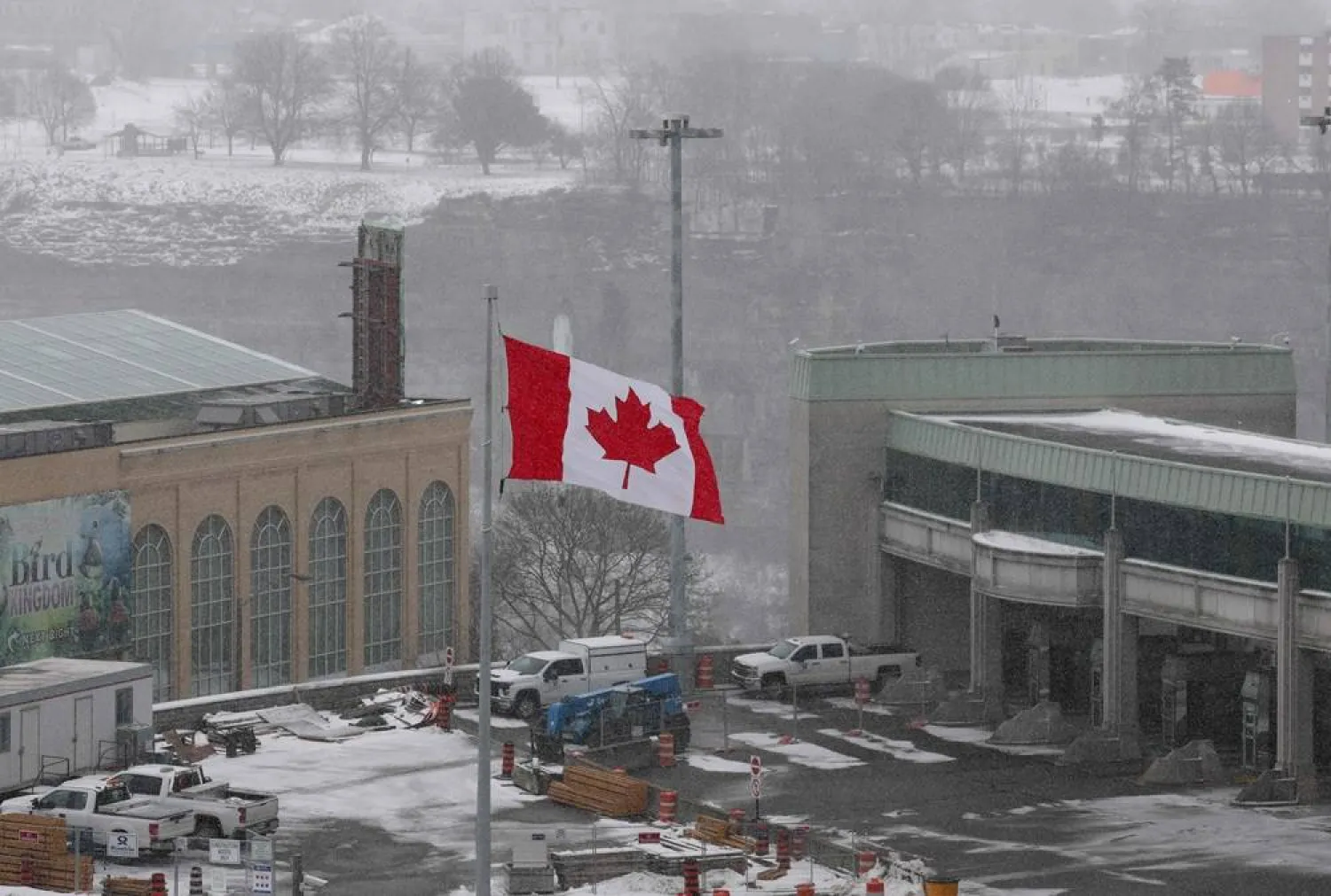 A Canadian flag flies next to the entry to the border crossing at Rainbow Bridge International on February 04, 2025 in Niagara Falls, Canada. (Getty Images via AFP) 
