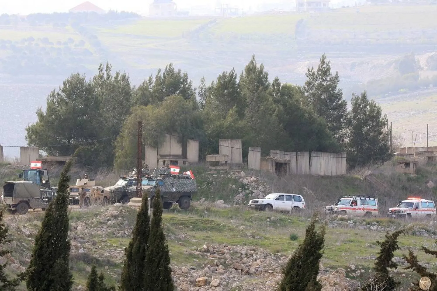 Lebanese army soldiers and ambulances drive towards the entrance of the southern Lebanese village of Houla on February 17, 2025. (AFP)