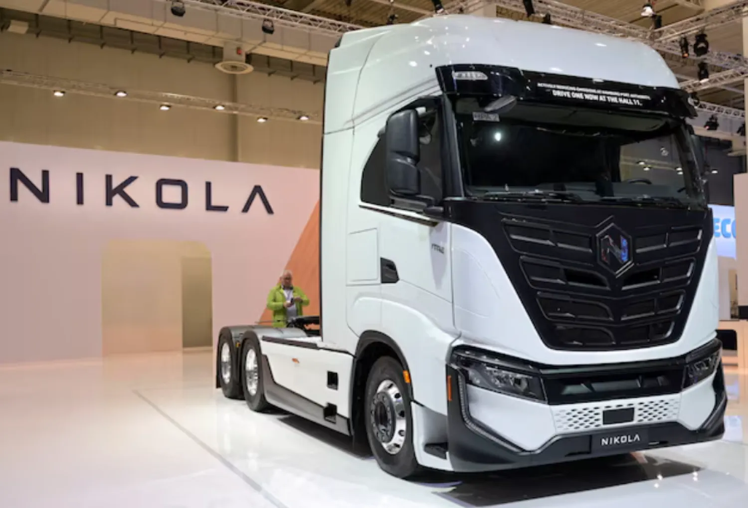 A member of the media stands behind a hydrogen-powered Artic truck at the booth of US truckmaker Nikola at the IAA Transportation fair, which will open its doors to the public on September 20, 2022, in Hanover, Germany, September 19, 2022. REUTERS/Fabian Bimmer/File Photo 