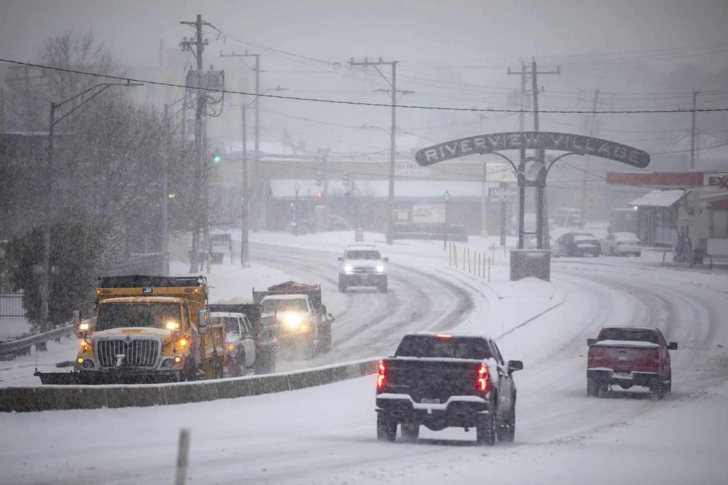 Snow plows make their way up the Granby Street bridge in Norfolk, Va. on Wednesday, Feb. 19, 2025. (Kendall Warner/The Virginian-Pilot via AP)