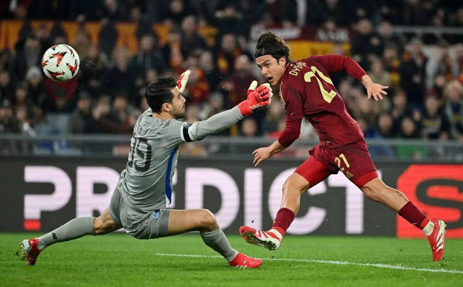 Football - Europa League - Knockout Phase Playoff - Second Leg - AS Roma v FC Porto - Stadio Olimpico, Rome, Italy - February 20, 2025 AS Roma's Paulo Dybala scores their first goal past FC Porto's Diogo Costa. (Reuters)