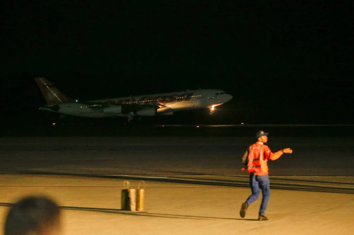 A Conviasa airplane lands with Venezuelan migrants flown from Guantanamo Bay via Honduras, at Simon Bolivar International Airport in Maiquetia, La Guaira State, Venezuela, February 20, 2025. (Reuters)