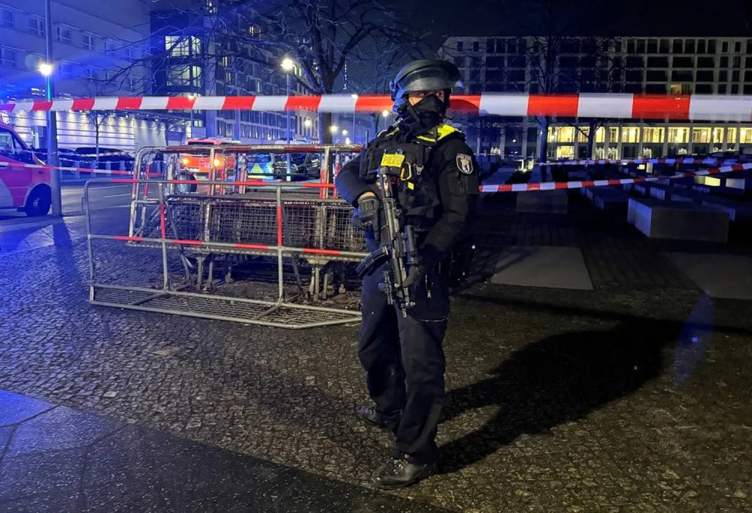 A German police officer guards the Holocaust Memorial after a man was seriously injured in a stabbing near the US Embassy in Berlin, Germany, February 21, 2025. (Reuters) 