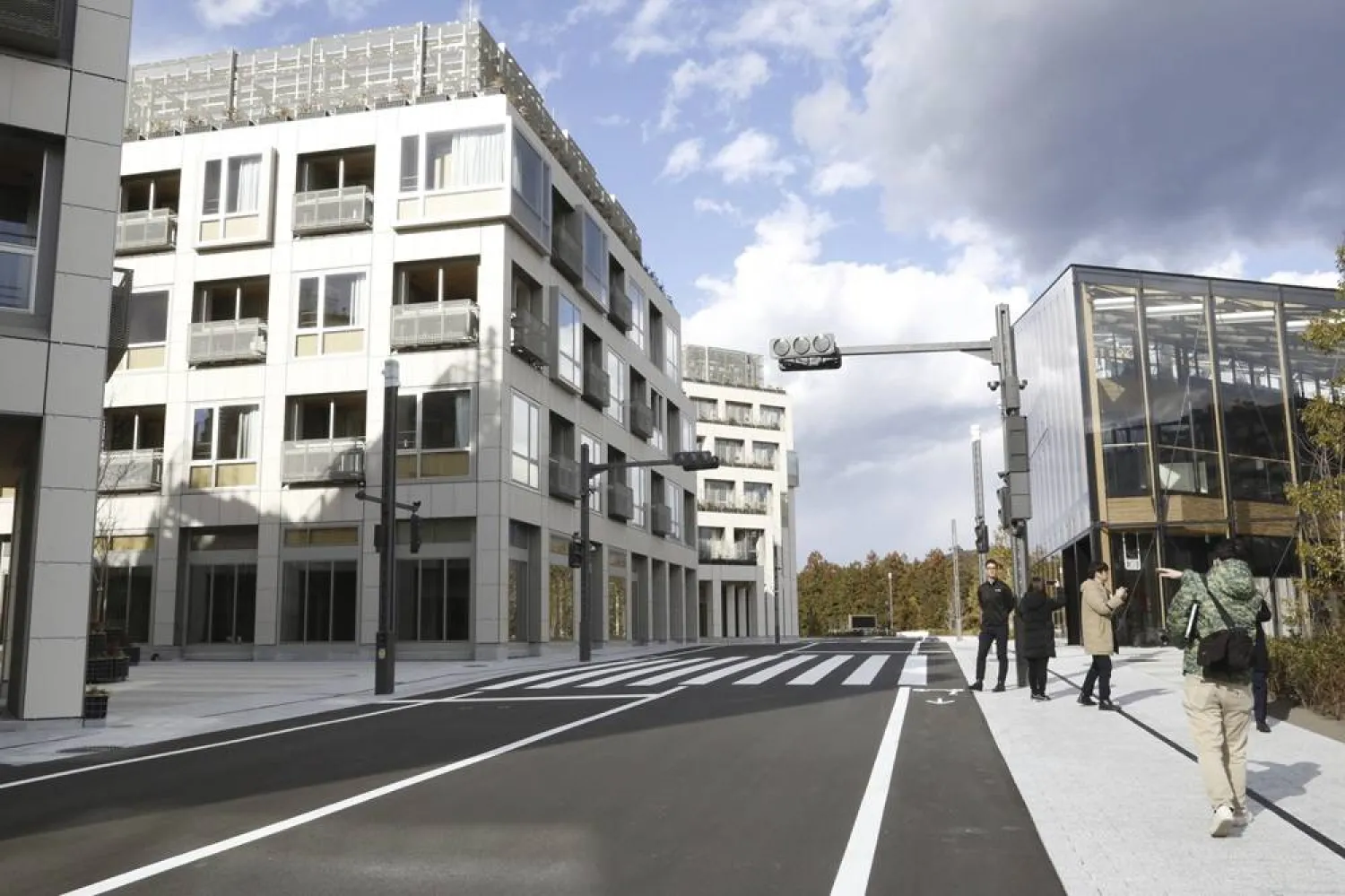  Reporters look at the first phase of construction of Toyota’s Woven City in Susono, Shizuoka Prefecture, Saturday, Feb. 22, 2025. (AP) 