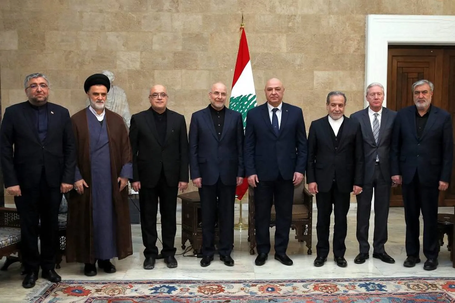 This handout picture released by the Lebanese Presidency shows President Joseph Aoun (4th-R) meeting with a delegation including Iran’s Foreign Minister Abbas Araghchi (3rd-R) and Parliament Speaker Mohammad Bagher Ghalibaf (C) at the presidential palace in Baabda on February 23, 2025. (Lebanese Presidency / AFP) 