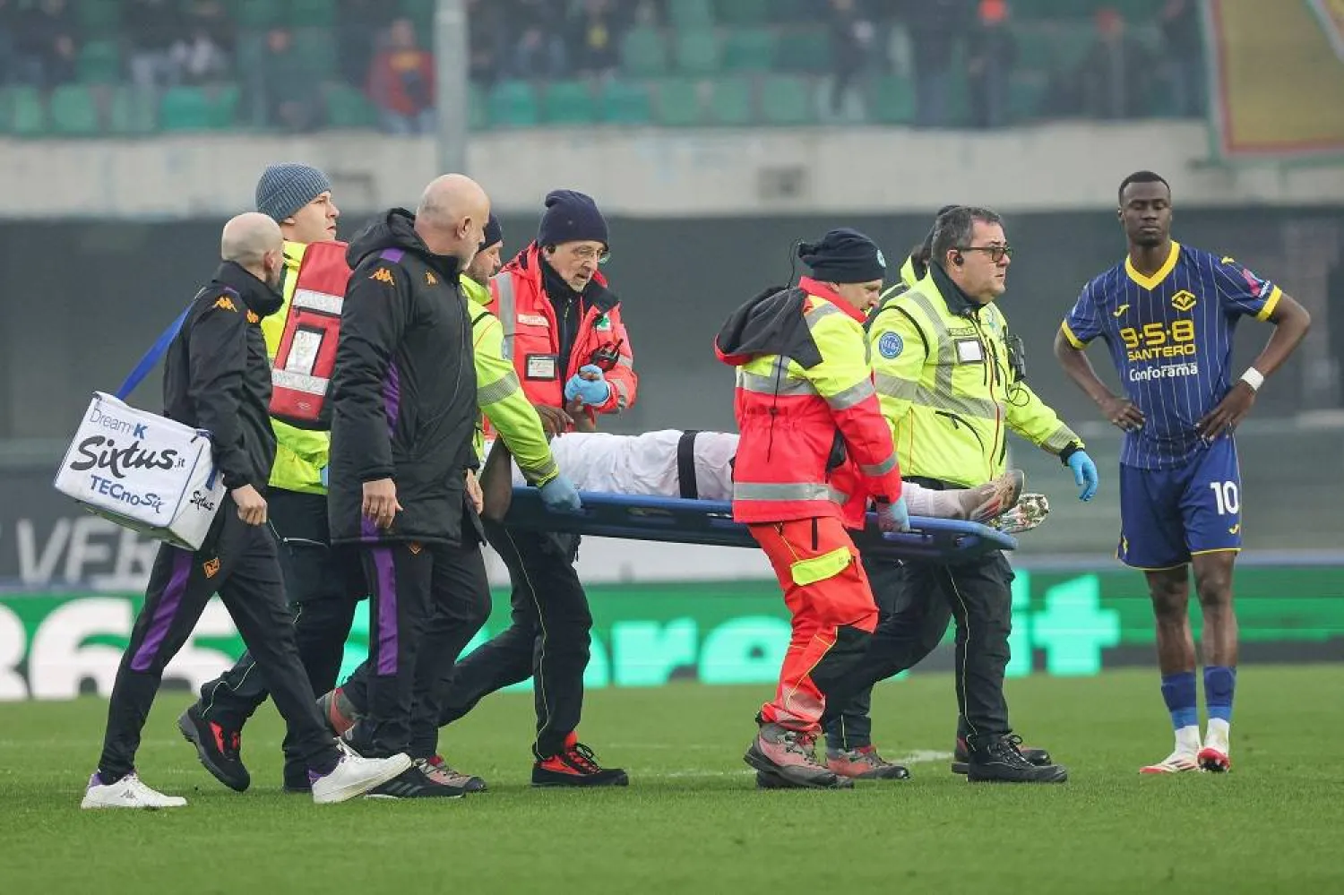 Fiorentina's Moise Kean is brought off the pitch on the stretcher injured during the Italian Serie A soccer match Hellas Verona FC vs Fiorentina at Marcantonio Bentegodi Stadium in Verona, Italy, 23 February 2025. (EPA)