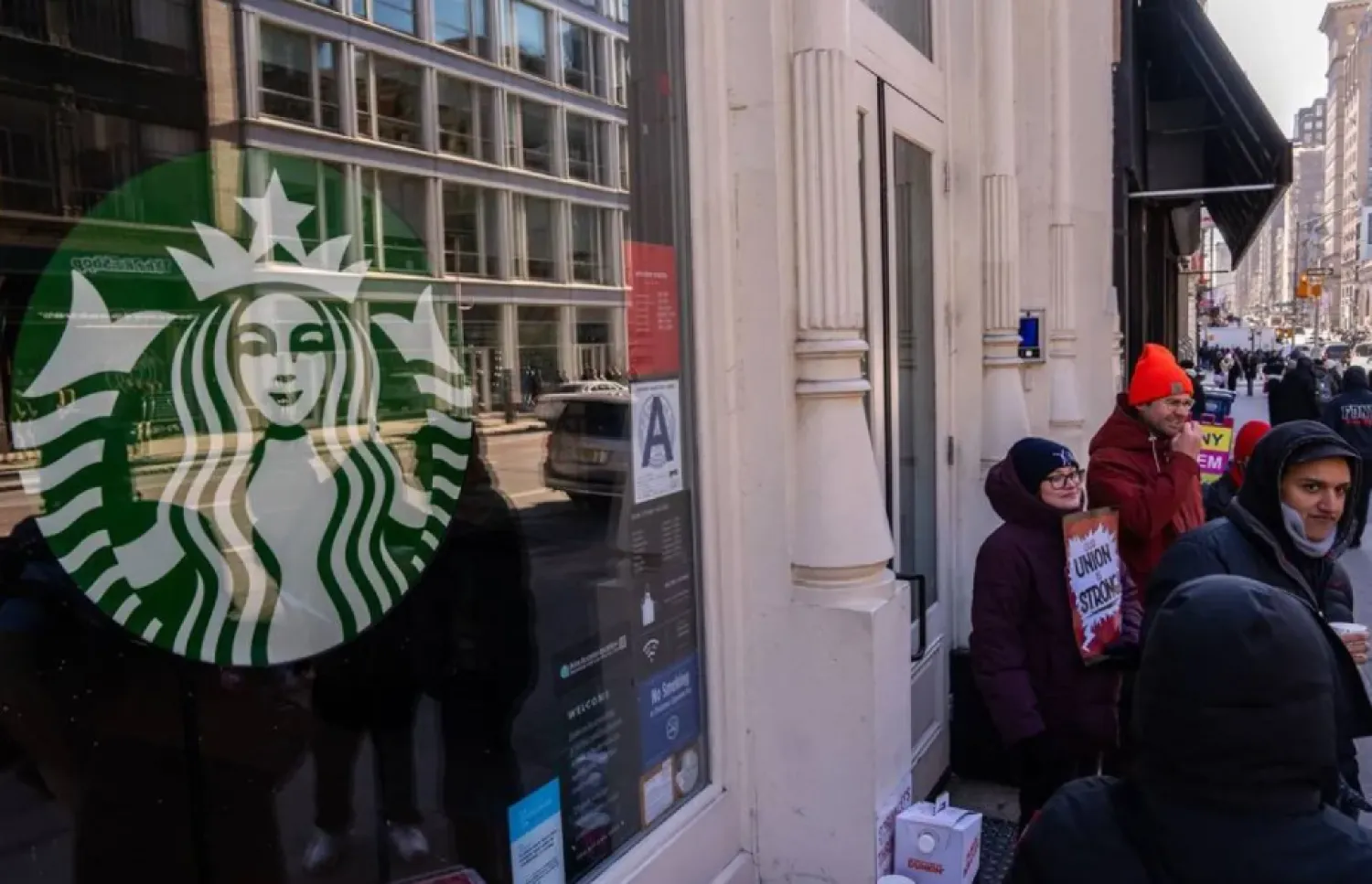 Starbucks employees, union members and supporters strike outside of a Starbucks store which is closed down due to the strike on December 23, 2024 in New York City. (Getty Images/AFP)
