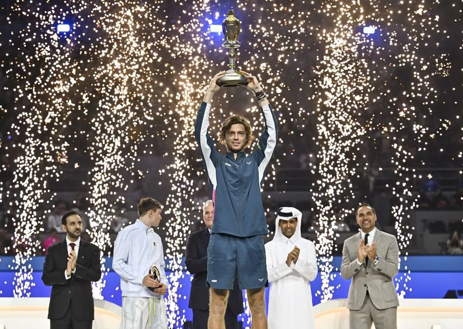 Winner Andrey Rublev of Russia poses with the trophy after winning the final against Jack Draper of Britain at the Qatar Open tennis tournament in Doha, Qatar, 22 February 2025. (EPA)