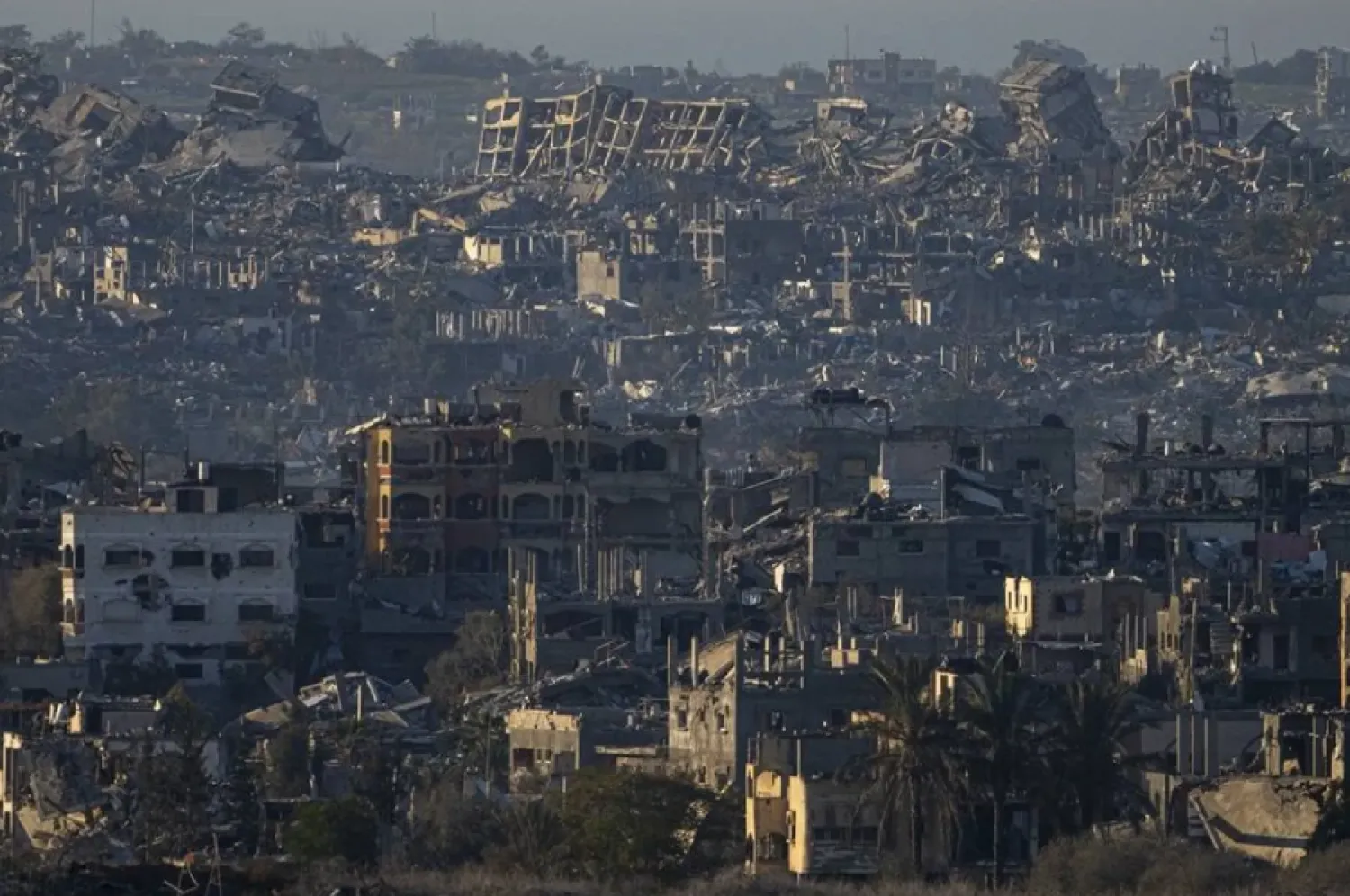 Destroyed buildings are seen inside the Gaza Strip from southern Israel, Monday, Jan. 13, 2025. (AP)
