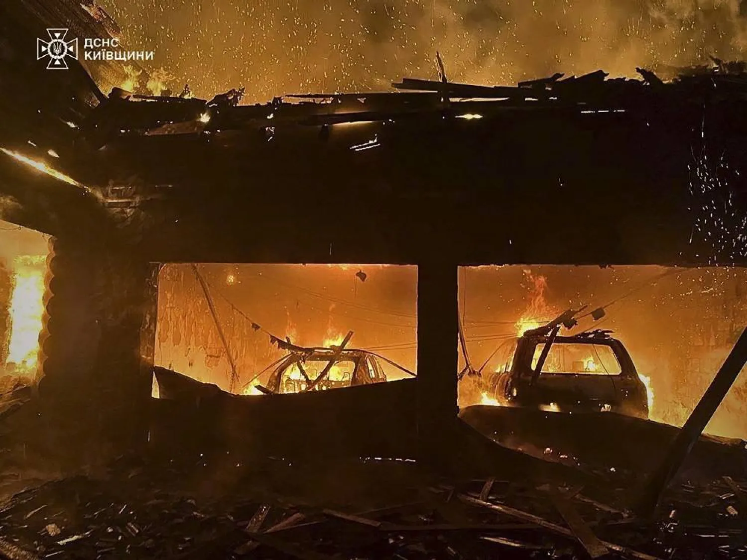 A handout photo made available by the State Emergency Service of Ukraine shows rescuers working at the site where a Russian shock drone hit a private building in Kryukivshchyna, outskirts of Kyiv, Ukraine, late 25 February 2025 (issued 26 February 2025). (EPA/ State Emergency Service/ Handout) 