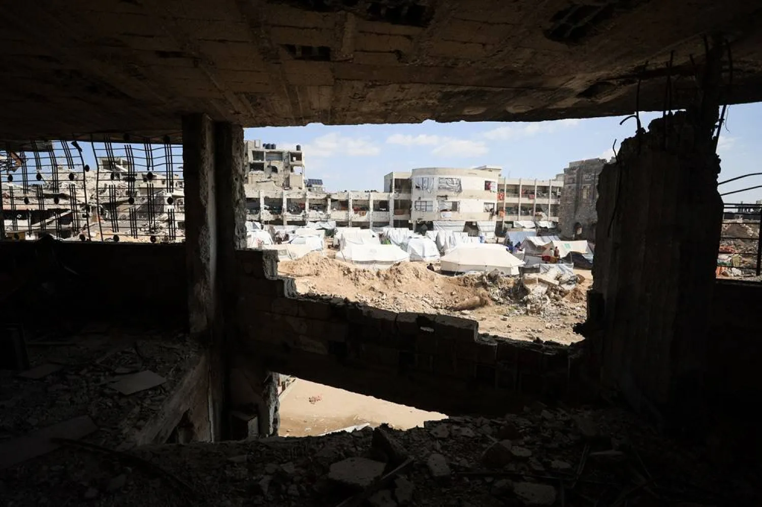  Palestinians sheltering in tents set up near the rubble of buildings, amid a ceasefire between Israel and Hamas, in Gaza City, February 26, 2025. (Reuters)