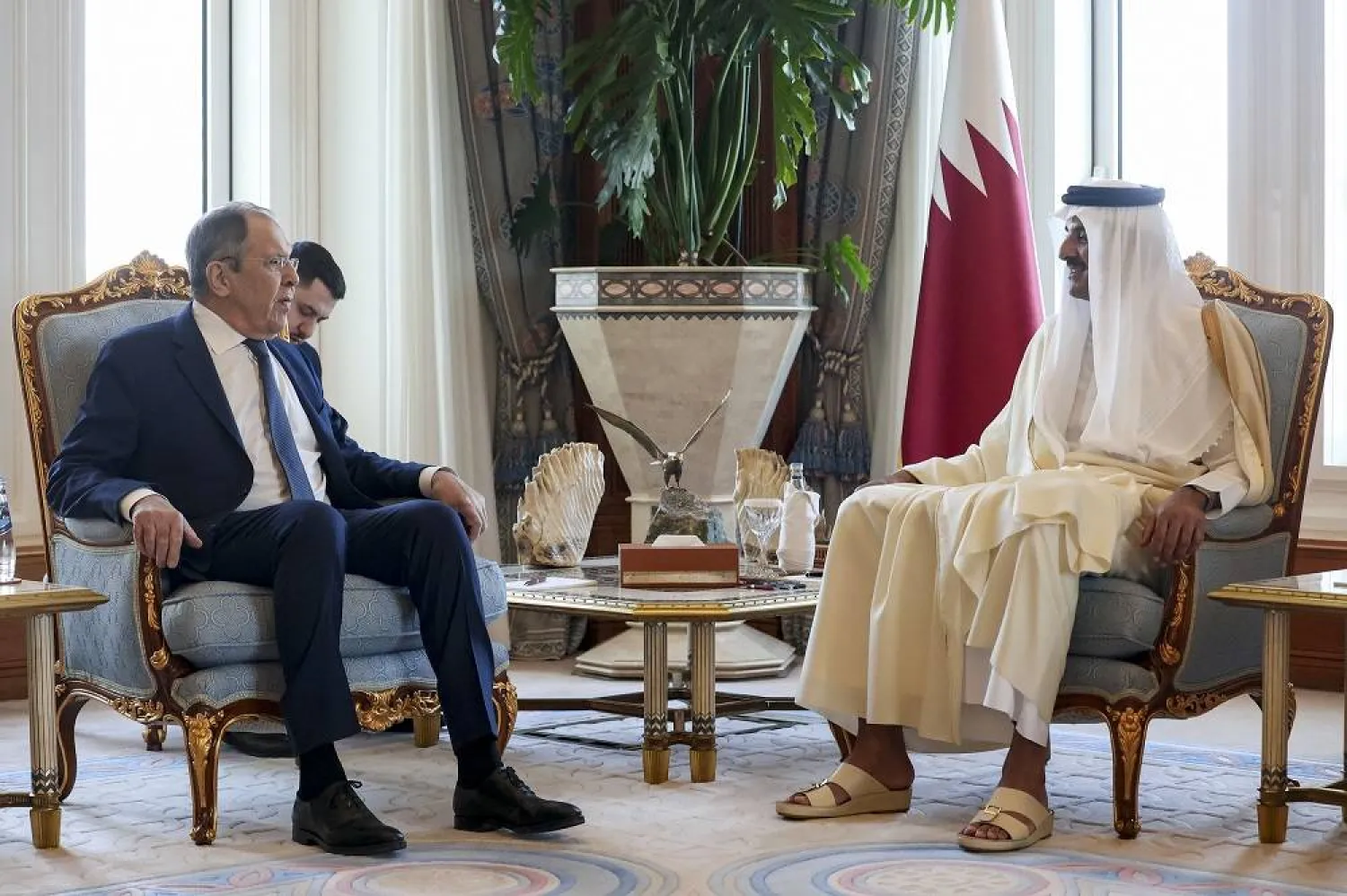 In this photo released by Russian Foreign Ministry Press Service, Russian Foreign Minister Sergei Lavrov, left, and Qatar's Emir Sheikh Tamim bin Hamad Al Thani pose for a photo prior to their talks in Doha, Qatar, on Wednesday, Feb. 26, 2025. (Russian Foreign Ministry Press Service via AP) 