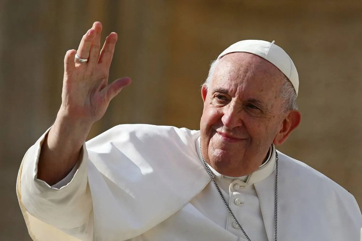 Pope Francis (L) waves at the end of his weekly general audience at Saint Peter's Square in the Vatican on October 26, 2022. (AFP)