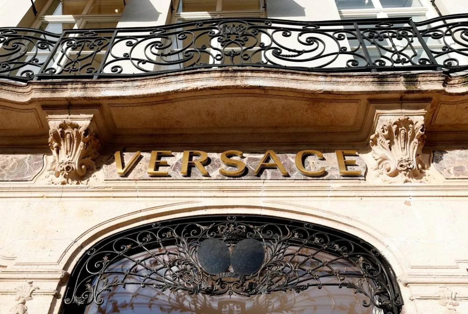 The logo of fashion house Versace is seen at the entrance of a store in Brussels, Belgium December 6, 2022. (Reuters) 