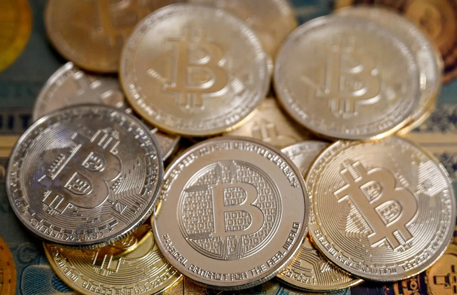 (FILES) This illustration photograph taken on November 22, 2024 in Istanbul shows coin imitations of Bitcoin. (Photo by Ozan KOSE / AFP)