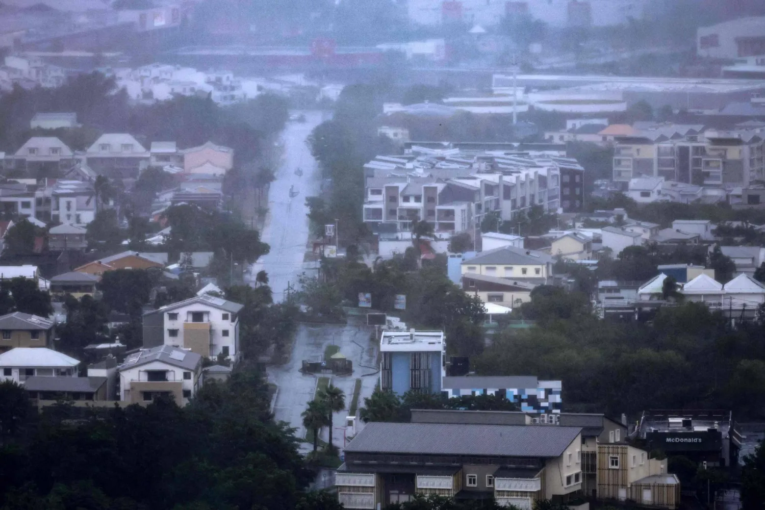 This photograph shows a view of the city of La Possession on the French overseas Indian Ocean island of La Reunion, as cyclone Garance nears on February 28, 2025. (Photo by Richard BOUHET / AFP)