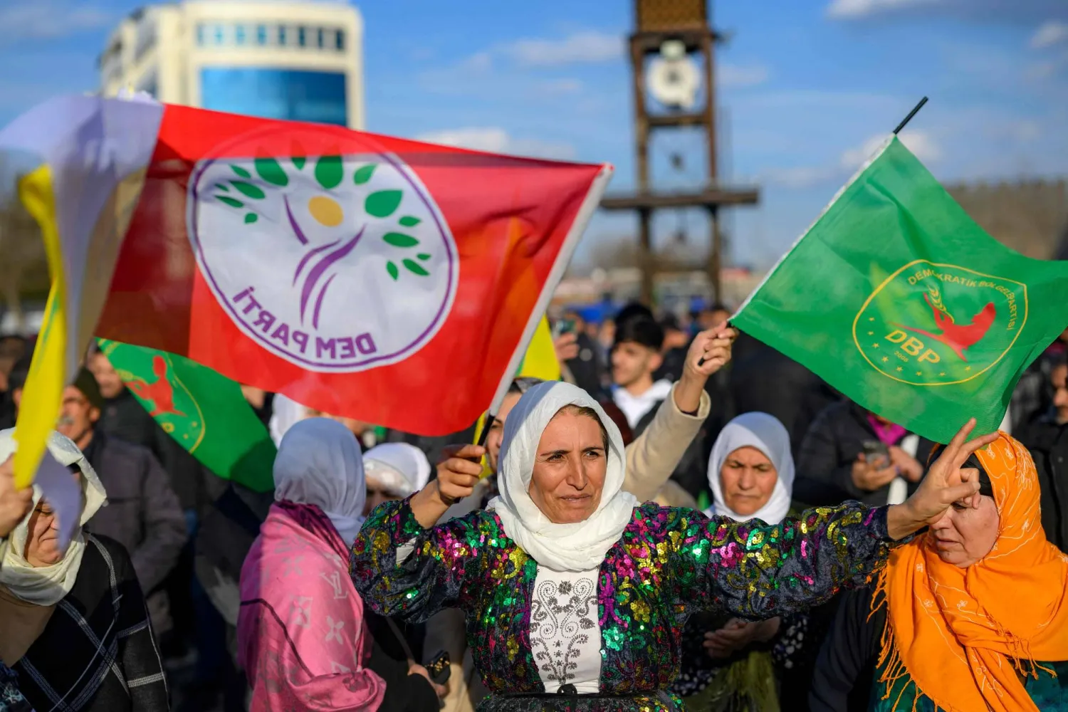 Supporters react after jailed leader of the Kurdistan Workers' Party (PKK) Abdullah Ocalan called on the Kurdistan Workers' Party (PKK) to disarm and dissolve itself in Diyarbakir, southeastern  Türkiye, on February 27, 2025. (Photo by Yasin AKGUL / AFP)