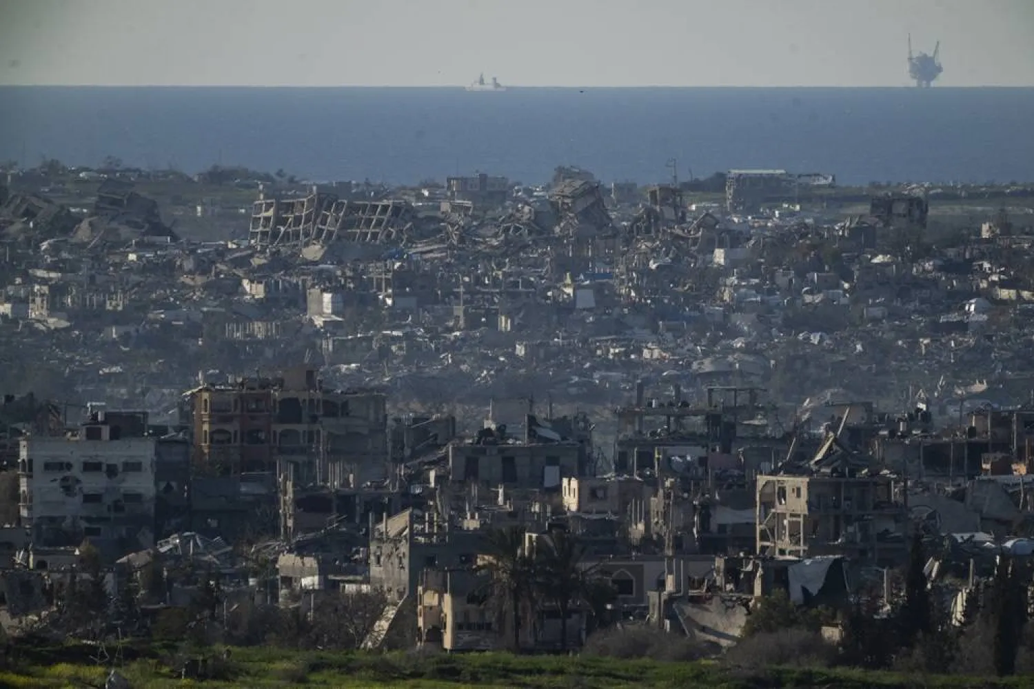 Buildings destroyed during the Israeli air and ground offensive stand in the Gaza Strip are seen from southern Israel, Sunday, March 2, 2025. (AP) 