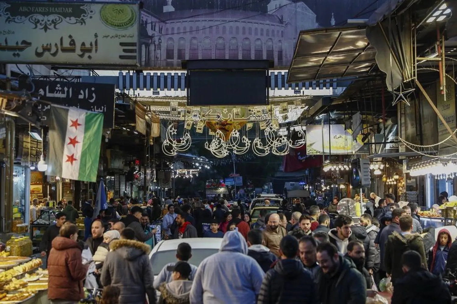 Residents walk in the market on the first day of Ramadan, the holy month for Muslims, in the old city of Damascus, Syria, Saturday March 1, 2025.(AP)