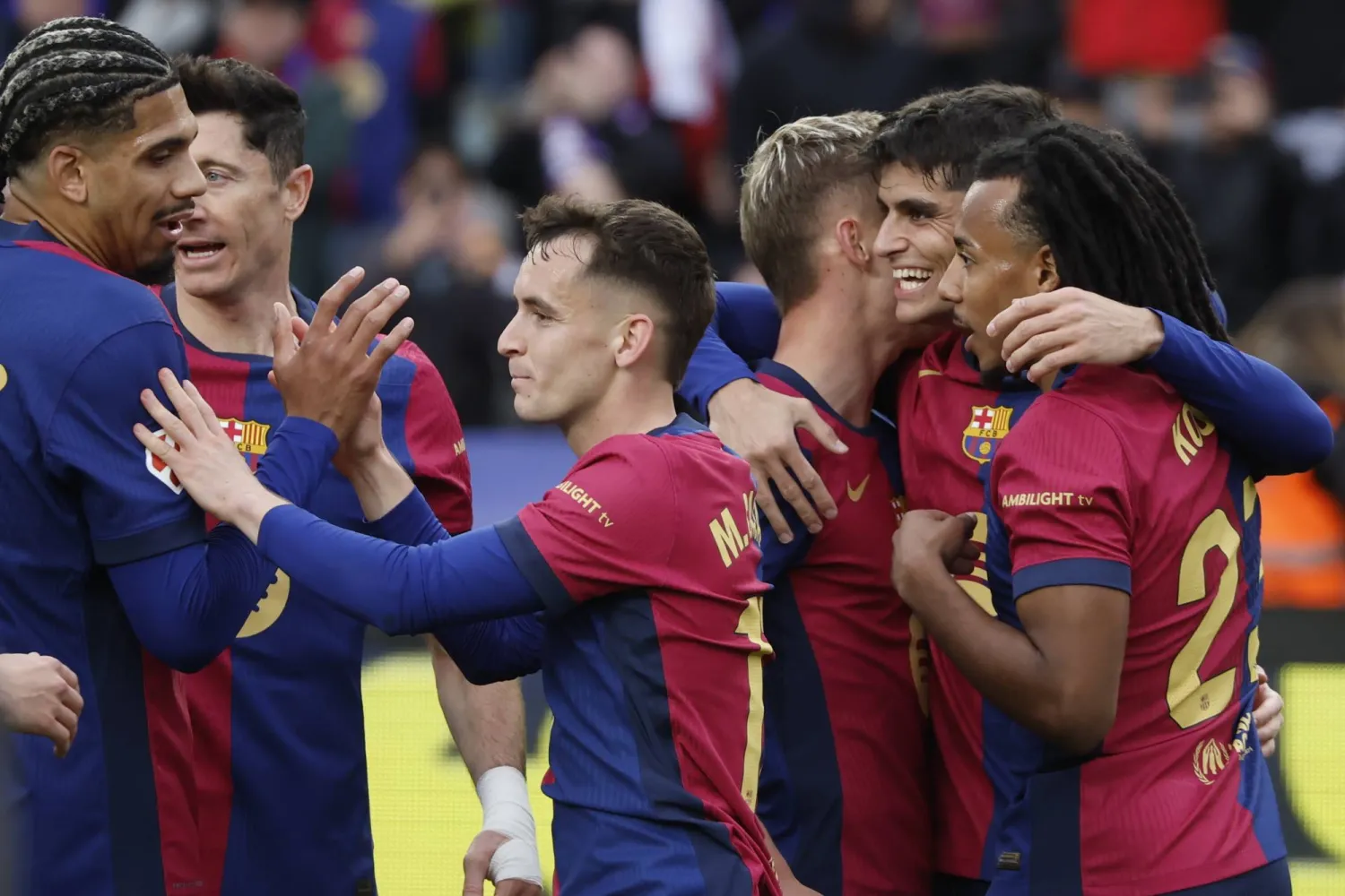 FC Barcelona midfielder Marc Casado (C) celebrates with his teammates after scoring the 2-0 lead during the Spanish LaLiga soccer match between FC Barcelona and Real Sociedad at the Montjuic Olympic stadium in Barcelona, Spain, 02 March 2025.  EPA/Andreu Dalmau