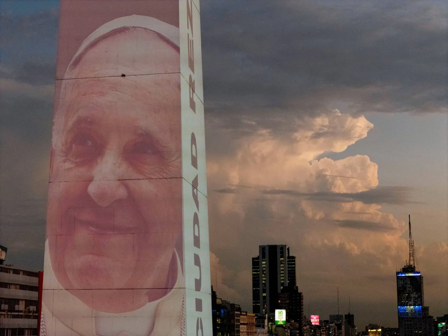 FILE PHOTO: A drone view shows an image of Pope Francis displayed with a digital video-mapping at the Obelisco as the worlds pray for the pontiff's health, in Buenos Aires, Argentina, February 21, 2025. REUTERS/Martin Cossarini/File Photo