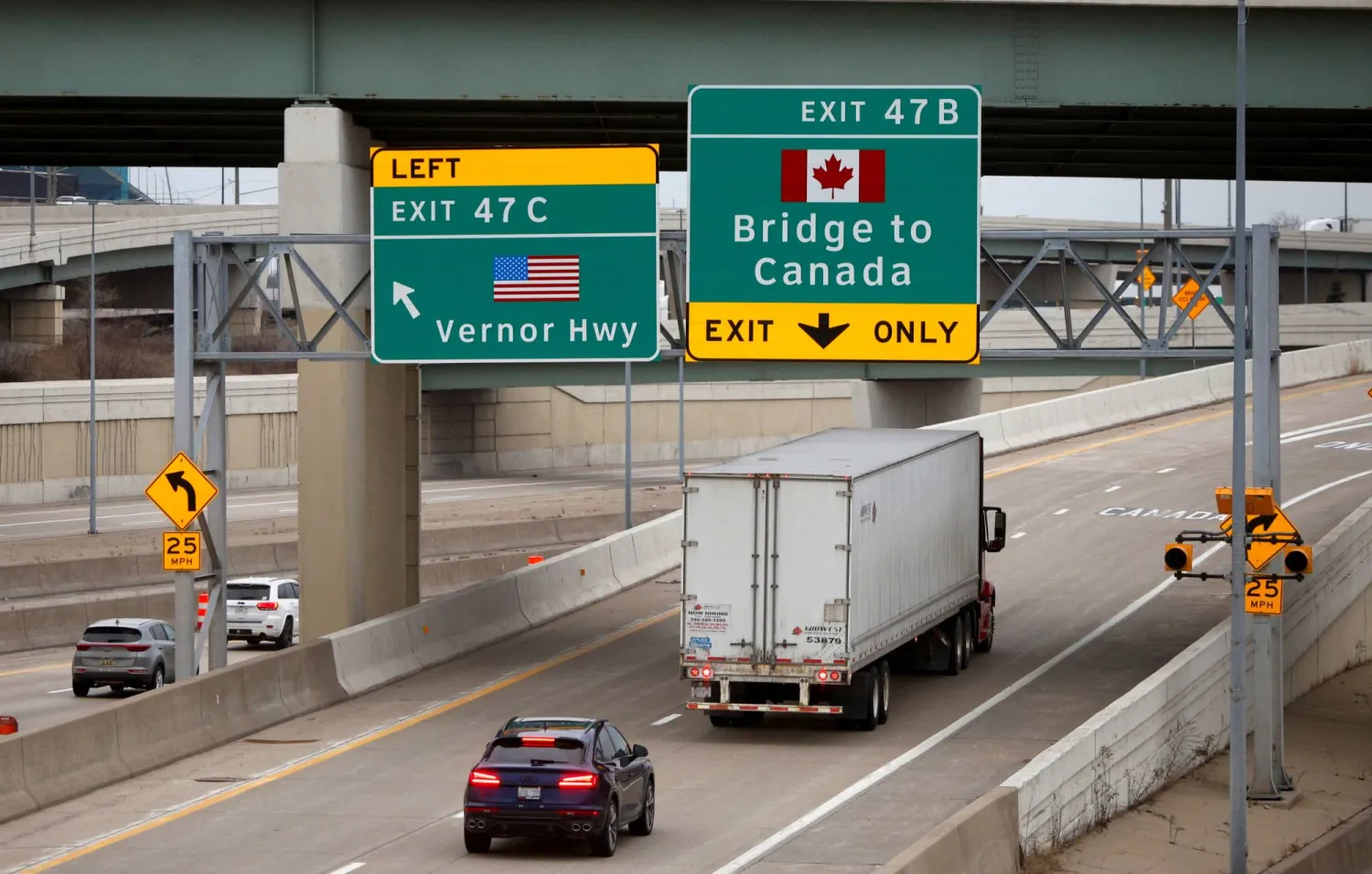 A commercial truck drives towards the Ambassador Bridge to Windsor, Ontario, Canada from Detroit, Michigan. US, March 3, 2025. REUTERS/Rebecca Cook
