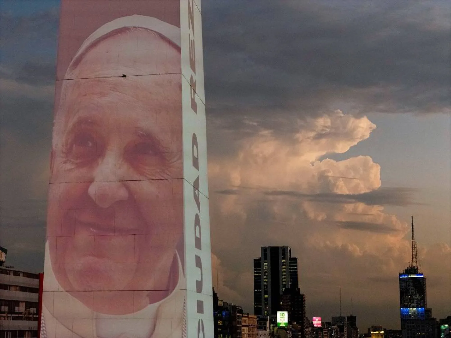 A drone view shows an image of Pope Francis displayed with a digital video-mapping at the Obelisco in Buenos Aires, Argentina, February 21, 2025. (Reuters)